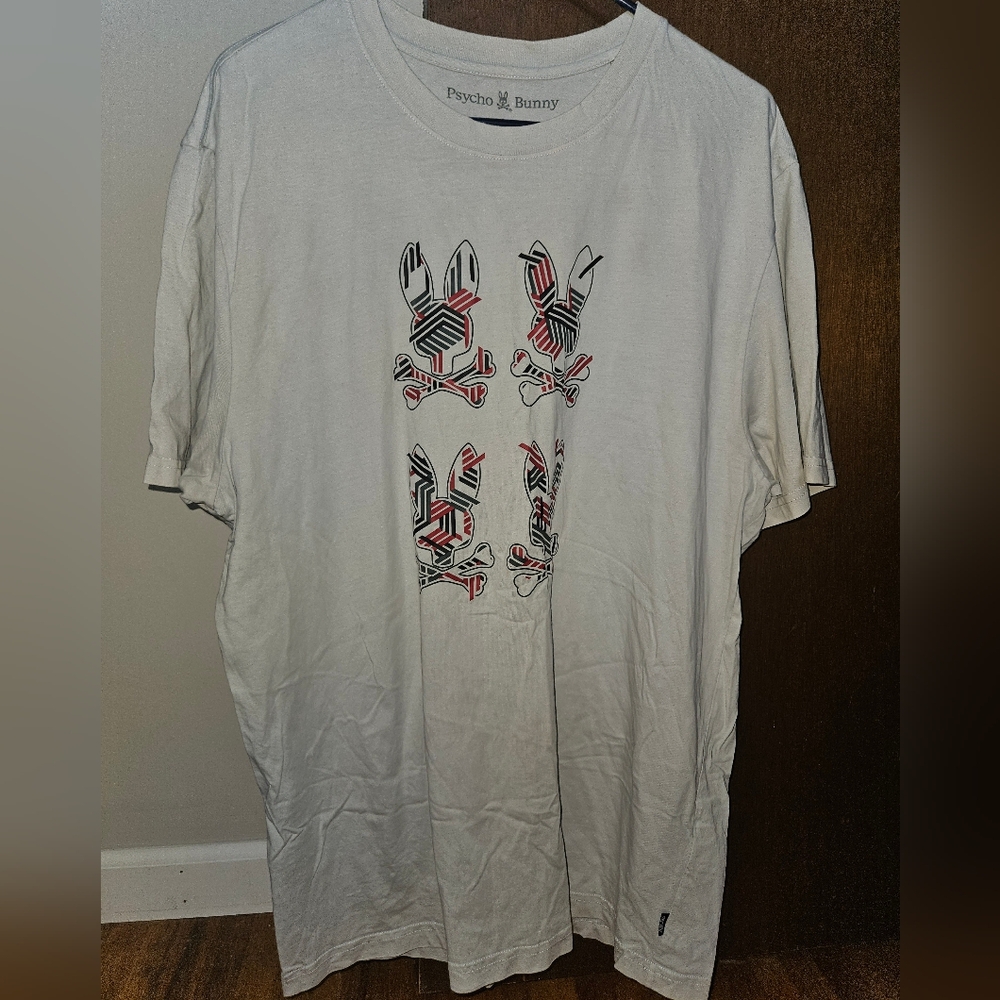 Psycho Bunny size 8 short sleeve t-shirt  with four logo design